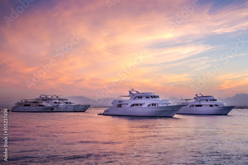 Sunset sea horizon view with yachts © LeysanI