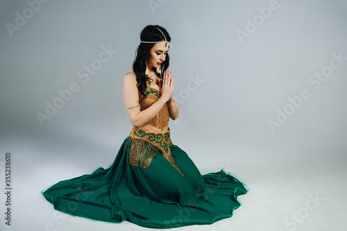 Sexy girl in oriental dress with jewelry