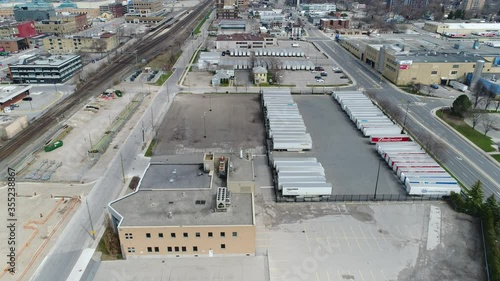 Aerial Over Empty Industrial Area by Labbatt Brewery and Budweiser Beer Trucks in Parking Lot photo