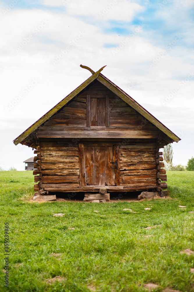 old traditional ukrainian house in a village. Museum under open sky in Kyiv Pirogovo, Ukraine. Spring in a village. Blooming trees old traditional ukrainian house in a village. Museum under open sky in Kyiv Pirogovo, Ukraine. Spring in a village. Blooming trees