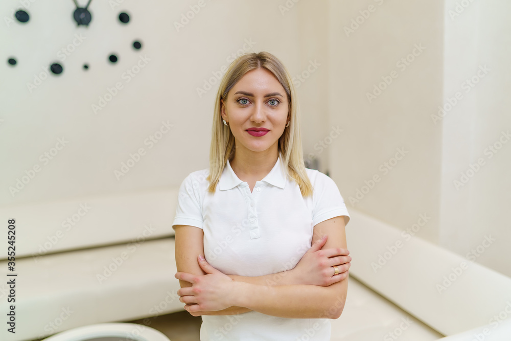 Woman stomatologist with dentist office in the background. Oral care concept. Dentist in white uniform. Portrait. Woman stomatologist with dentist office in the background. Oral care concept. Dentist in white uniform. Portrait.