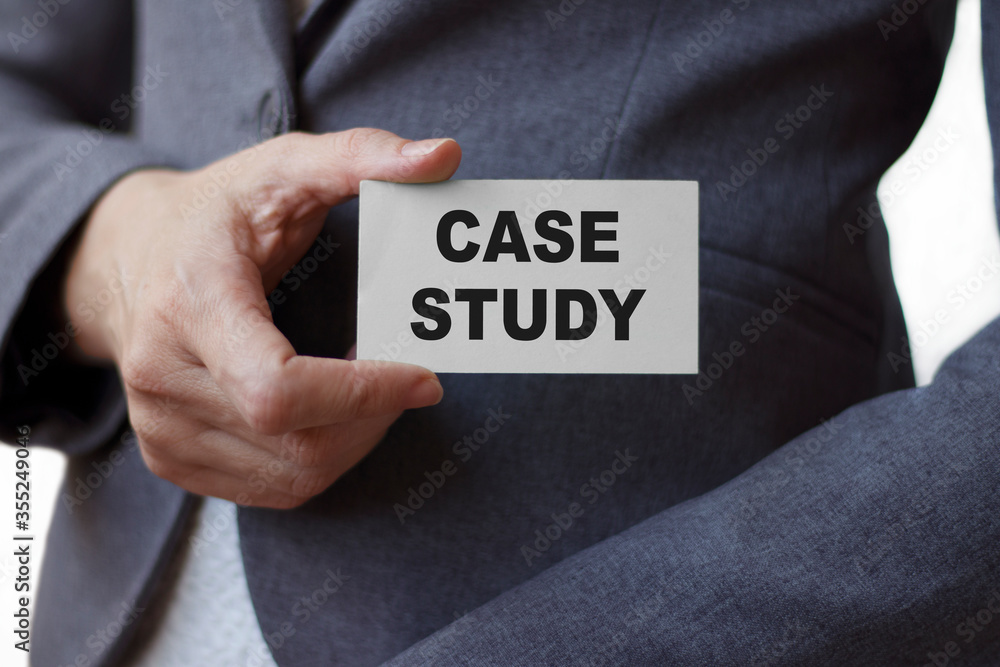 Businesswoman shows card with text Case study. Business or medical concept. Businesswoman shows card with text Case study. Business or medical concept.