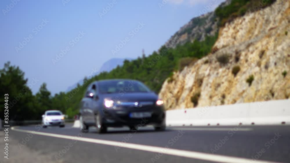 Front view of approaching cars on a country road. Motion Blur. Asphalt mountain road in Anatolia, Turkey. 4K Static Shot, color graded file in Pana Cine-like Dynamic range
Front view of approaching cars on a country road. Motion Blur. Asphalt mountain road in Anatolia, Turkey. 4K Static Shot, color graded file in Pana Cine-like Dynamic range
