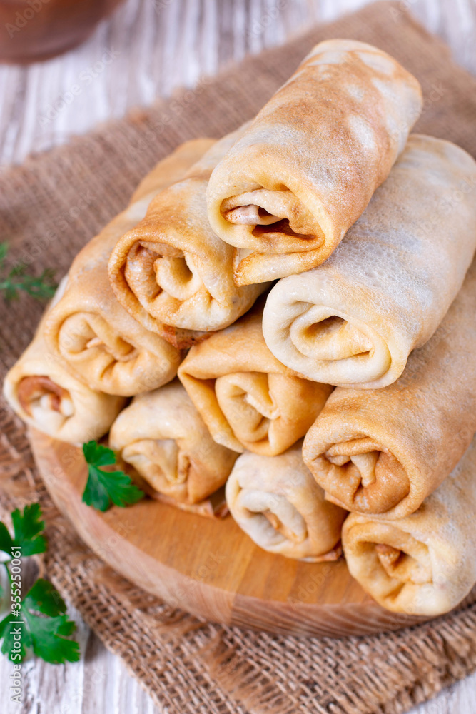 Rolls pancakes stuffed with meat and rice Rolls pancakes stuffed with meat and rice