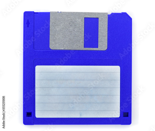 Blue floppy disk with blank label on white background photo