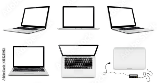 Set of vector laptops with blank screens in different positions © fad82