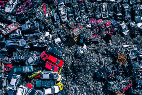 Scrapyard Aerial View. Old rusty corroded cars in car junkyard. Car recycling industry from above.