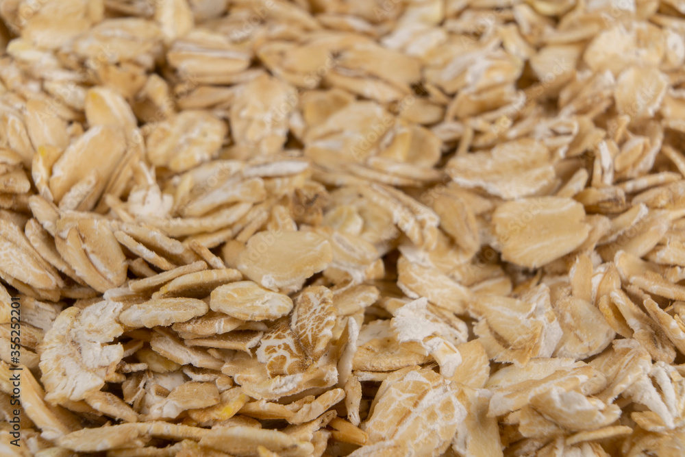 Oatmeal groats close-up in a jar on the background Oatmeal groats close-up in a jar on the background