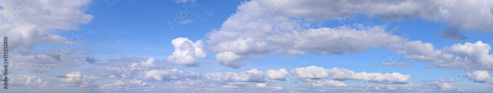 September is the autumn sky.
Panoramic photo of dense clouds flying low above the ground.