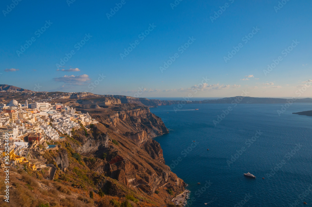 Santorini view with part of city and sea with ships