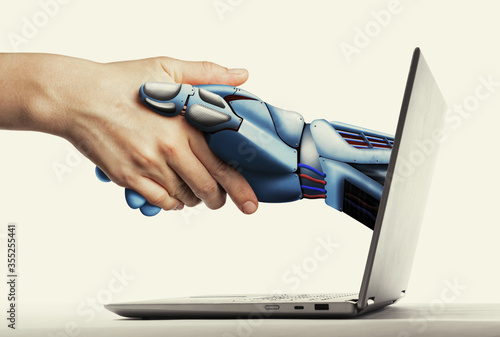 The handshake human with artificial intelligence via laptop. Artificial intelligence, concept of future.