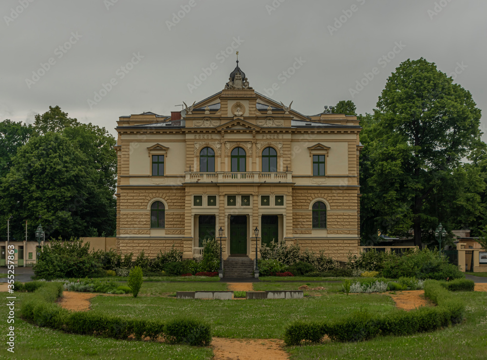 Old historic building in rainy park in Plzen city in west Bohemia