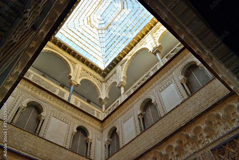 architectural details of the Patio de las Muñecas inside the famous Royal Alcazar Palace in Seville in Andalusia, Spain
