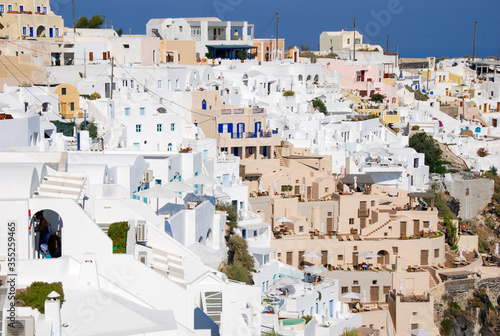 White houses at the edge of the cliff at the village of Oia in Santorini Greece.