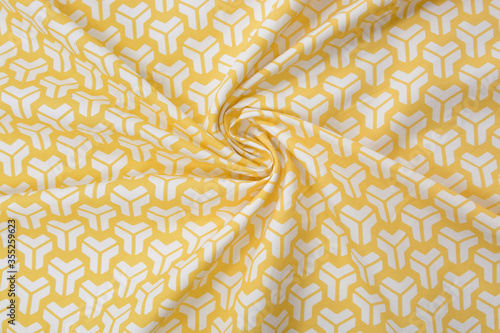 White and yellow cotton fabric in pattern, background, top view