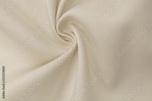 Abstract folds. Delicate drapery. Beige color.
