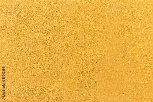 Yellow concrete wall background texture