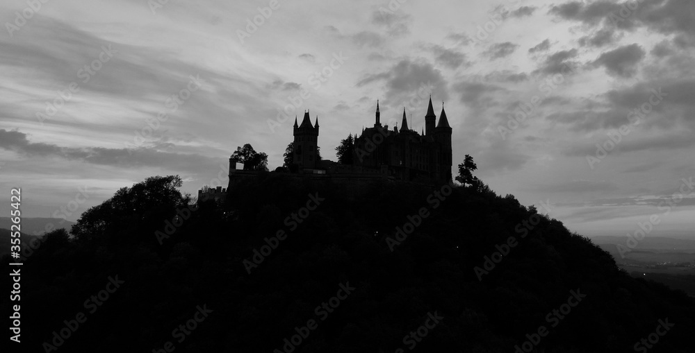 Silhouette of castle on a hill against the sky