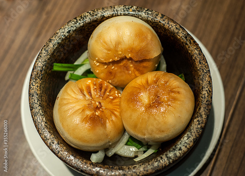 Photography Kuala Lumpur, Malaysia - January 21, 2020 :3 pieces of Oriental BBQ pork/chicken buns serve on bow