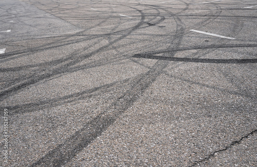 Wallpaper Mural Asphalt texture with white line and tire marks.  Smooth asphalt road. Tarmac dark grey grainy road background.Top view Torontodigital.ca