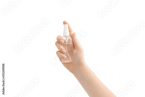 Woman holds alcohol-based hand-washing spray as a preventive hygiene measure against coronavirus. Isolated on white background.
