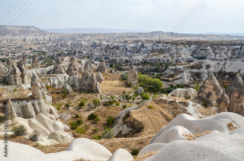 Unique fancy geological mountain formations with dovecotes of the Pigeon valley in Goreme, Cappadocia, Turkey