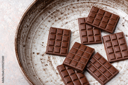 Mini chocolate bars on a plate.