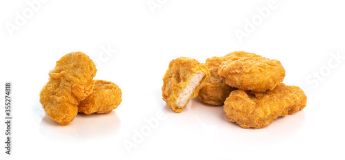 Quadro em tela Fried chicken nuggets isolated on white background