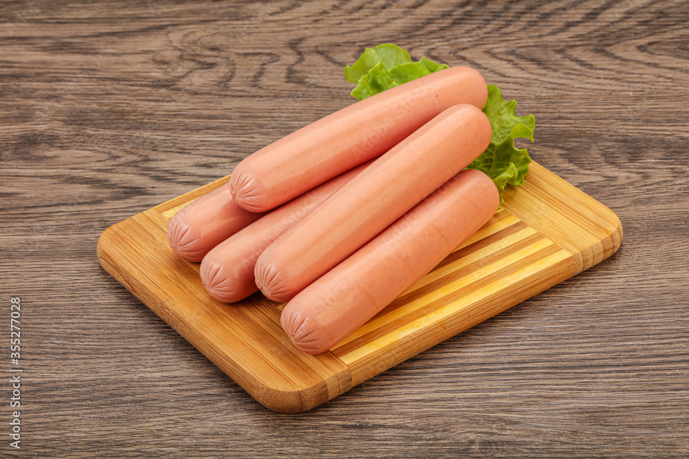 Tasty meat sausages over board Tasty meat sausages over board