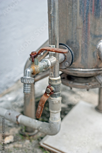 Bilde på lerret Subang Jaya, Selangor, Malaysia - December 27, 2019 : Outdoor master whole house stainless steel water purification filter system with brass tap