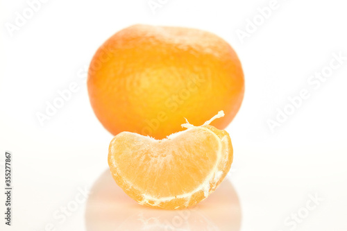Bright yellow juicy  fresh  organic tangerines  close-up  on a white background.