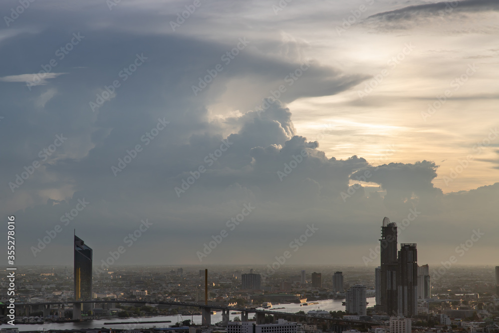 Naklejka premium Sky view of Bangkok with skyscrapers in the business district in Bangkok in the evening beautiful twilight give the city a modern style. Selective focus.