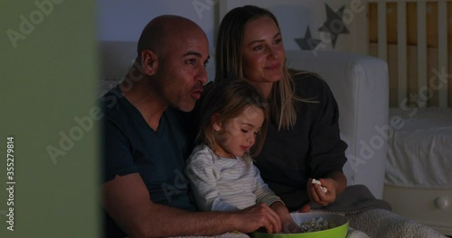 4K Video of happy family watching tv