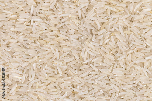 Large scattering of rice grains. Studio shot.