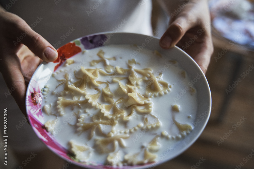 Delicious pasta with milk on a plate Delicious pasta with milk on a plate