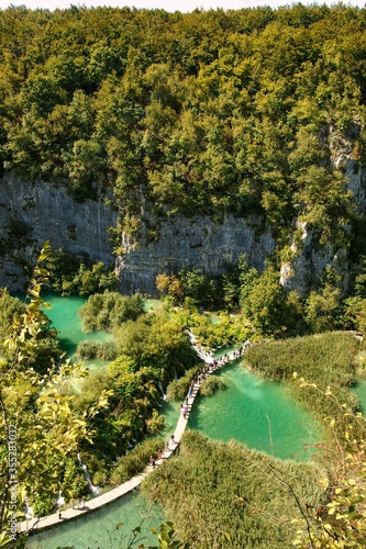 Plitvice Lakes National Park, Croatia, 2015. Nacionalni park Plitvička jezera, one of the oldest and largest national parks. UNESCO World Heritage. View from above on pedestrian trail among lakes. 