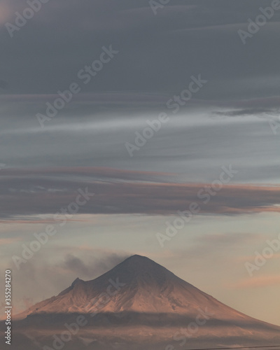 A volcano with clouds