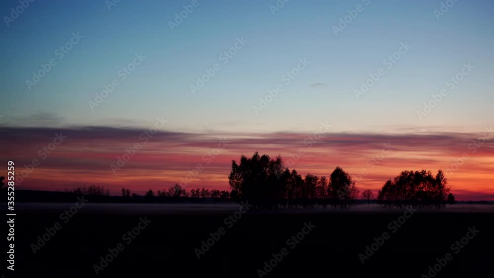 Sunset over foggy autumn field. Time lapse Sunset over foggy autumn field. Time lapse