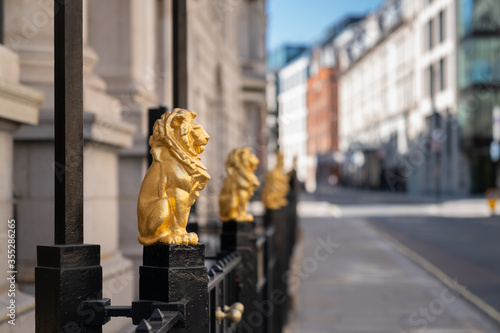 Gilded golden lions sitting on top of the metal railings outside the Law Society at Chancery Lane, London, England - 1 photo