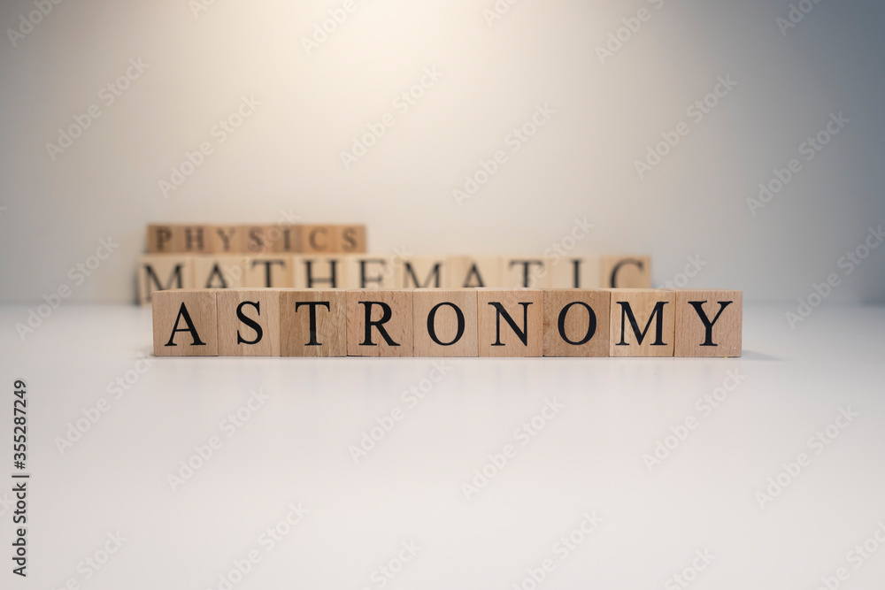 Mathematics, astronomy, economy words with letters from wooden cubes Mathematics, astronomy, economy words with letters from wooden cubes