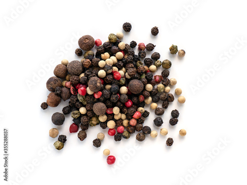 A mixture of peppers. Black, white, red polka dots. Isolated on a white background. Selected sharpness