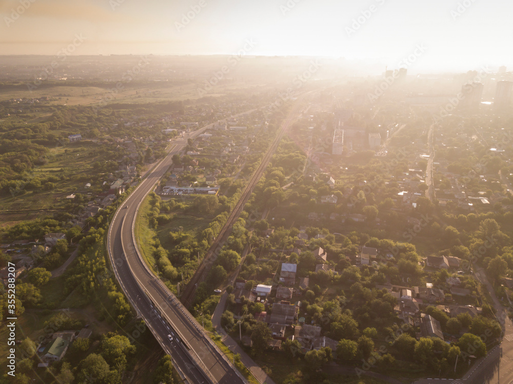 Aerial view of the road to city, sun light