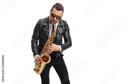 Man in a leather jacket playing a saxophone