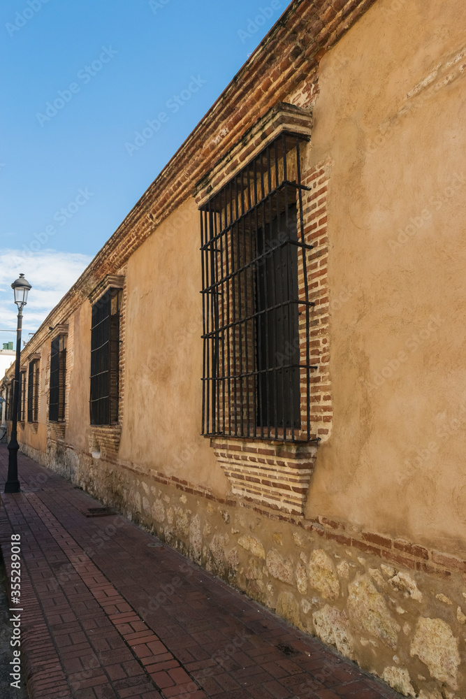 Narrow pedestrian zones and facades in the colonial zone of Santo Domingo, Dominican Republic. 