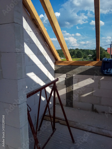 Poland, 2019. Construction of detached house. House construction site. Construction of terriva ceiling. Aerated concrete blocks. Sunny summer day. photo