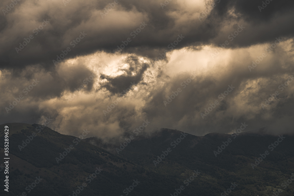 Mysterious black mountain with dramatic cloudy sky