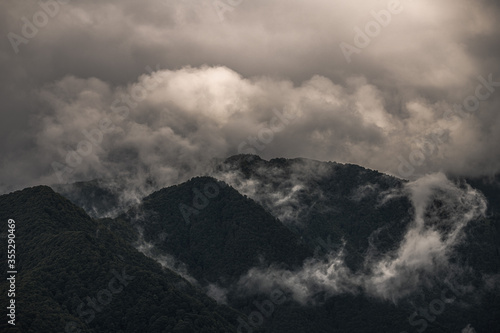 Mysterious black mountain with dramatic cloudy sky