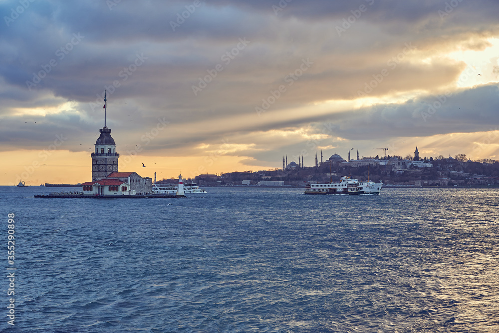 Istanbul sunet panorama with landmarks, Maiden Tower / Kiz Kulesi, Hagia Sophia and Bosphorus. Istanbul, Turkey

