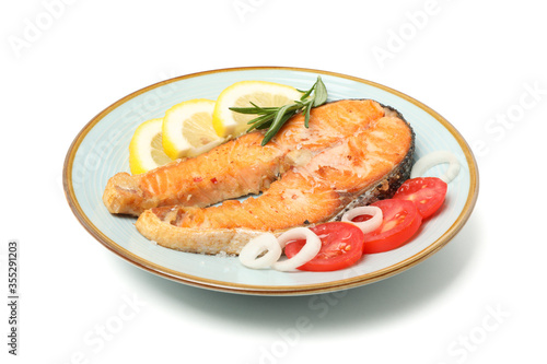 Plate with grilled salmon isolated on white background