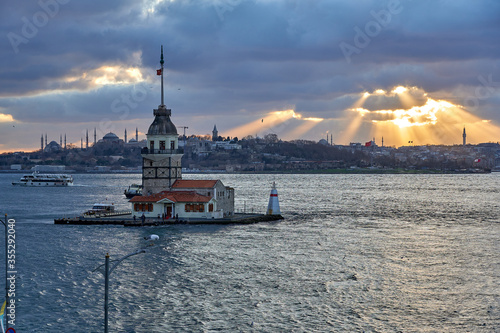 Istanbul sunet panorama with landmarks, Maiden Tower / Kiz Kulesi, Hagia Sophia and Bosphorus. Istanbul, Turkey

 photo